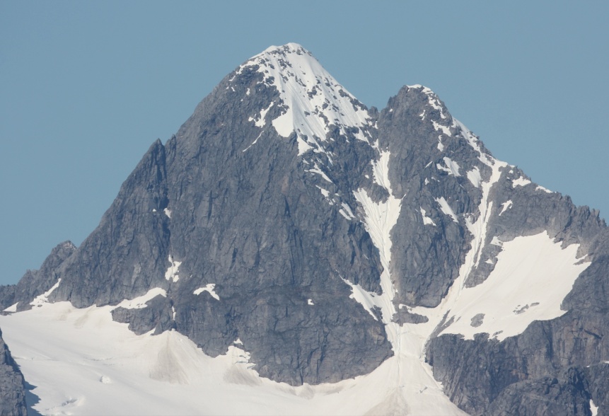 Avalanche chutes are clearly visible on the mountain tops