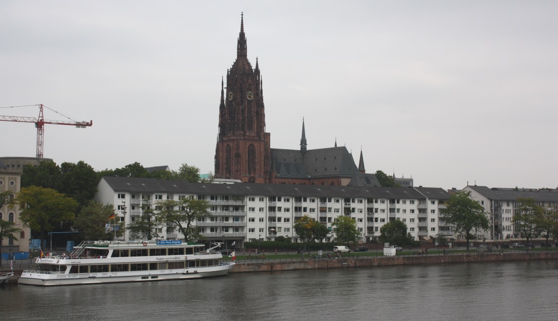 Frankfurt Cathedral towers behind some river side condos