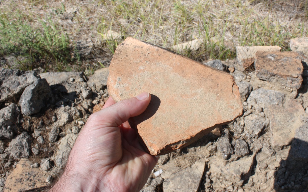 Holding a very old brick