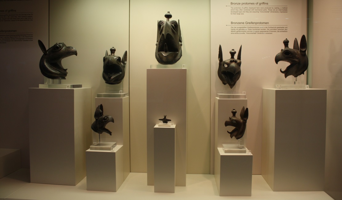 Bronze heads of griffins