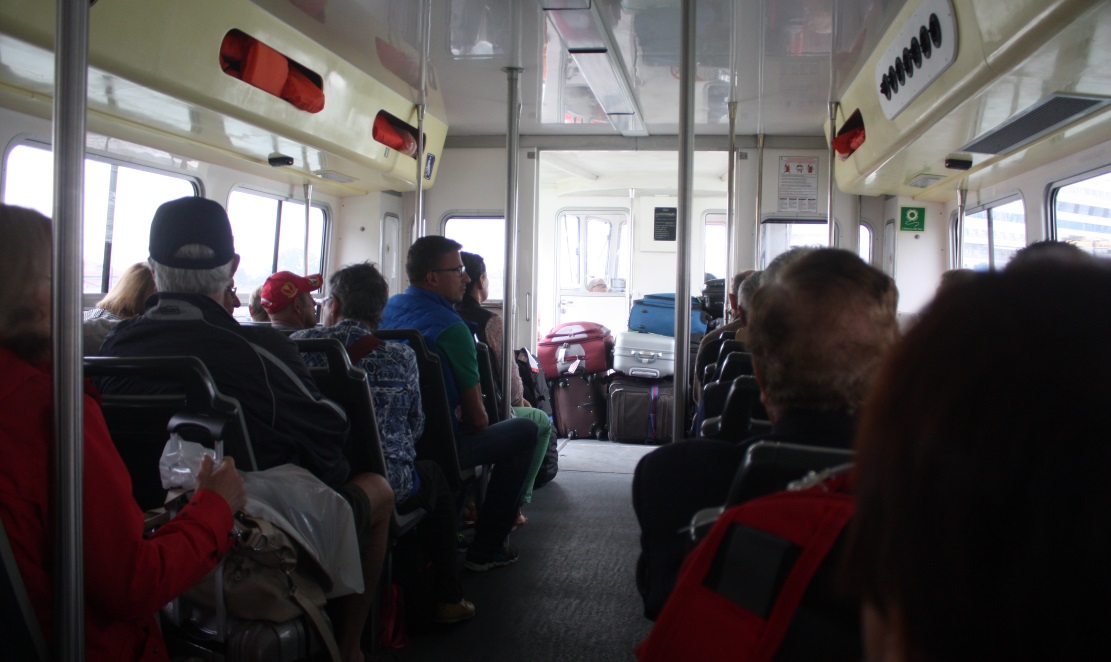 Riding a water taxi from the port to Saint Mark's Square