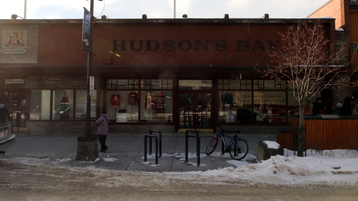 Frozen Angelita walks past the Hudsons Bay Company store