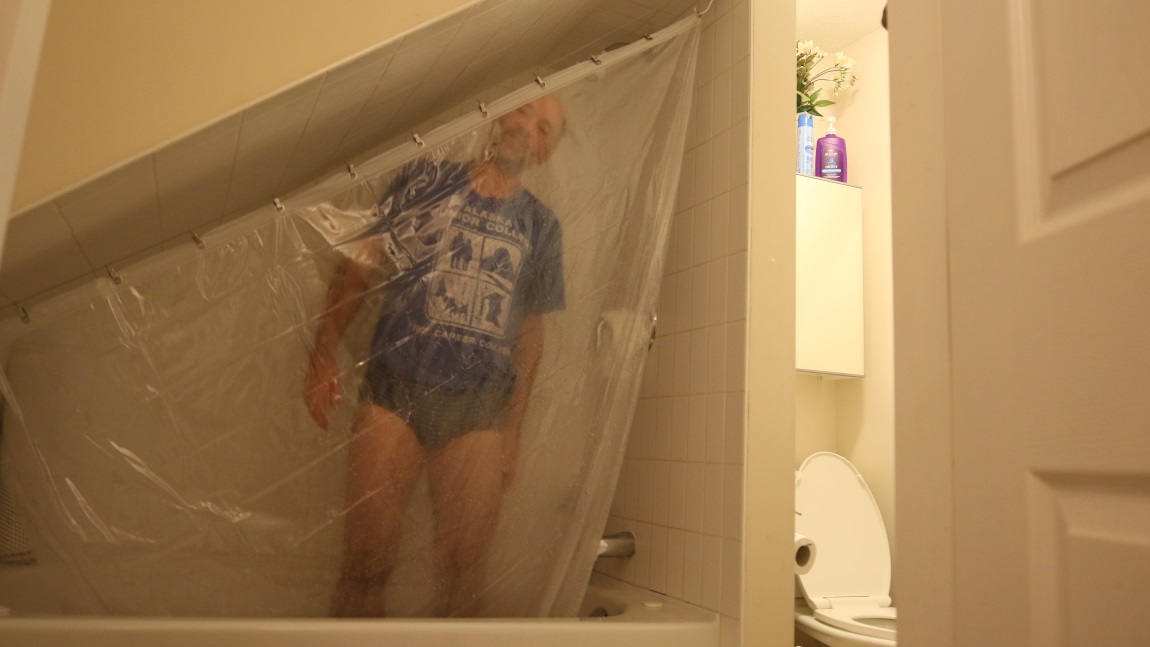 Neat shower under a staircase
