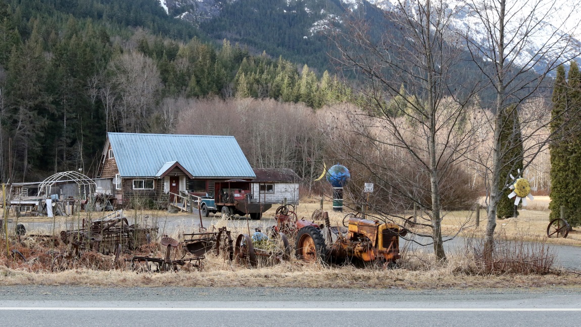 House with Sun Moon and Earth sculptures