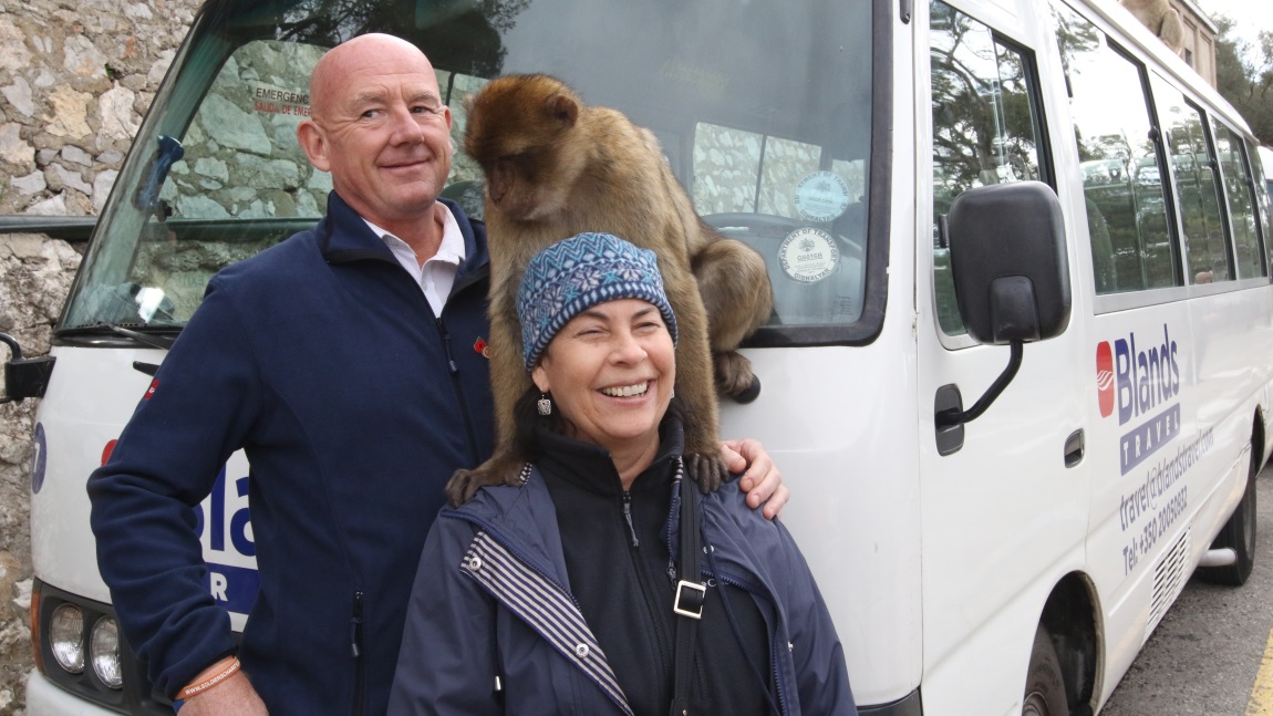 Pose with one of the monkeys